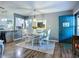 Open dining area next to the kitchen, featuring a decorative mirror and chandelier at 9616 Oak Ridge Ave, Riverview, FL 33578