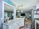 Bright, updated kitchen featuring granite countertops, white cabinetry, and pendant lighting at 9616 Oak Ridge Ave, Riverview, FL 33578