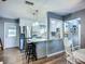 Modern kitchen with stainless steel appliances, granite countertops, and a breakfast bar at 9616 Oak Ridge Ave, Riverview, FL 33578