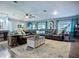 Spacious living room featuring comfortable seating, area rug, and lots of natural light at 9616 Oak Ridge Ave, Riverview, FL 33578