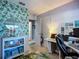 Charming office space featuring vibrant wallpaper, and ample natural light at 9616 Oak Ridge Ave, Riverview, FL 33578
