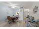 Bright dining area leading to the hallway offering a cozy space for meals and gatherings at 100 Glennes Ln # 207, Dunedin, FL 34698