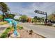 Street view showcases Florida's First Trail Town, featuring a decorative dolphin statue at 100 Glennes Ln # 207, Dunedin, FL 34698