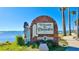 Welcome to Dunedin sign featuring a bagpiper and waterfront background, showcasing the city's charm at 100 Glennes Ln # 207, Dunedin, FL 34698