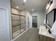 A beautifully designed bathroom with a glass-enclosed shower and a double vanity at 107 E Park St, Tarpon Springs, FL 34689
