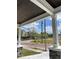 View from the covered porch showing the stone and white wood accents and the exterior at 107 E Park St, Tarpon Springs, FL 34689