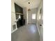 Well-lit laundry room with a dark accent wall and modern sink at 107 E Park St, Tarpon Springs, FL 34689