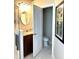 Bathroom showcasing a vanity with tiled flooring, and a toilet in a private alcove at 11344 Heritage Point Dr, Hudson, FL 34667
