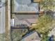 An aerial view that shows the roof, yard, and nearby street and adjacent houses at 11817 Mango Cross Ct, Seffner, FL 33584