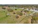 Aerial view of a community park with walking paths, trees, and green spaces for recreation at 11817 Mango Cross Ct, Seffner, FL 33584