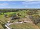 An aerial view of a neighborhood park that features walkways, shade and seating areas at 11817 Mango Cross Ct, Seffner, FL 33584