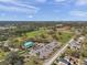 Aerial view of community park featuring green spaces, a baseball stadium, and recreational areas at 11817 Mango Cross Ct, Seffner, FL 33584