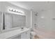 Bathroom with a pink tub, tile flooring, single vanity, and a large mirror at 11817 Mango Cross Ct, Seffner, FL 33584