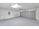Spacious garage with an automatic door and ample room for storage and parking at 11817 Mango Cross Ct, Seffner, FL 33584