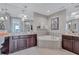 Luxurious bathroom with dual vanity and large soaking tub at 130 Riviera Dunes Way # 203, Palmetto, FL 34221