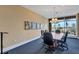 Functional conference room featuring a large table, comfortable chairs, and ample natural light at 130 Riviera Dunes Way # 203, Palmetto, FL 34221