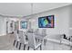 Dining room with modern art and a beautiful chandelier creating an inviting atmosphere at 130 Riviera Dunes Way # 203, Palmetto, FL 34221