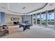 Spacious game room featuring a pool table, with large windows overlooking the tropical landscape at 130 Riviera Dunes Way # 203, Palmetto, FL 34221