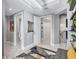 Hallway featuring neutral walls, decorative art, and access to the elevator at 130 Riviera Dunes Way # 203, Palmetto, FL 34221
