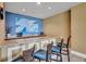 Functional kitchenette with modern appliances, granite countertops, and a convenient breakfast bar at 130 Riviera Dunes Way # 203, Palmetto, FL 34221