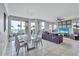 Bright living room with water views, elegant dining area and comfortable seating at 130 Riviera Dunes Way # 203, Palmetto, FL 34221