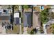 An aerial view of the neighborhood showcasing the property's location, roof, yard, and surrounding houses at 1423 W Wood St, Tampa, FL 33604