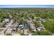 A scenic aerial view of a well-maintained neighborhood with mature trees and manicured lawns at 1423 W Wood St, Tampa, FL 33604