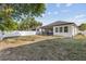 Expansive backyard features a white fence, providing privacy and space for outdoor activities and relaxation at 1423 W Wood St, Tampa, FL 33604