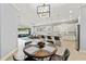 Open floor plan combines kitchen and dining area perfect for entertaining with modern finishes and updated appliances at 1423 W Wood St, Tampa, FL 33604