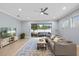 Bright living room with neutral color palette, lots of natural light and sliding glass doors to the patio at 1423 W Wood St, Tampa, FL 33604