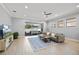 Living room features sliding glass doors to the patio, neutral color palette, and lots of natural light at 1423 W Wood St, Tampa, FL 33604
