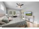 Comfortable bedroom with a large bed, a dresser with TV, big windows and light-colored flooring at 1423 W Wood St, Tampa, FL 33604
