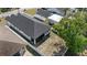 An aerial shot capturing the home's backyard with a black porch and new vinyl fence for privacy at 1423 W Wood St, Tampa, FL 33604