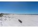 Peaceful beach view featuring a quiet bench overlooking the vast sandy expanse at 200 120Th W Ave # 3A, Treasure Island, FL 33706