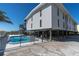 Inviting pool area with lounge chairs, perfect for relaxation at 200 120Th W Ave # 3A, Treasure Island, FL 33706