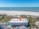 Aerial view of the property reveals its proximity to the beach, pool, and Gulf Coast at 200 120Th W Ave # 3A, Treasure Island, FL 33706