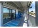 Spacious balcony seating area with views of the ocean and beachside at 200 120Th W Ave # 3A, Treasure Island, FL 33706