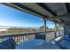 Covered balcony with beach views and seating area at 200 120Th W Ave # 3A, Treasure Island, FL 33706