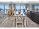 Dining room features an extended dining table with seating, and ocean view through sliding glass doors at 200 120Th W Ave # 3A, Treasure Island, FL 33706