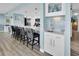 Kitchen with breakfast bar, stainless appliances, ample countertops, and light blue accents at 200 120Th W Ave # 3A, Treasure Island, FL 33706