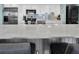 Kitchen featuring stainless appliances, stone countertops, white cabinetry, and island seating at 200 120Th W Ave # 3A, Treasure Island, FL 33706