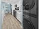 This modern kitchen has stainless steel appliances, white cabinets, and an in-unit washer and dryer at 200 120Th W Ave # 3A, Treasure Island, FL 33706
