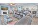 Open-concept living room and kitchen area with comfortable seating and access to outdoor spaces at 200 120Th W Ave # 3A, Treasure Island, FL 33706