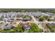 An aerial view of a residential neighborhood featuring homes with pools and manicured landscaping at 2017 Godfrey Ave, Spring Hill, FL 34609