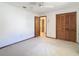 Bedroom showcasing closet doors, and carpeted floors at 2017 Godfrey Ave, Spring Hill, FL 34609