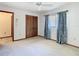 Bedroom showcasing closet doors, a fan, and carpeted floors at 2017 Godfrey Ave, Spring Hill, FL 34609