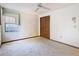 This is a standard bedroom with neutral walls, carpet, and a closet at 2017 Godfrey Ave, Spring Hill, FL 34609
