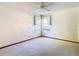 This is a standard bedroom with neutral walls, carpet, and a ceiling fan at 2017 Godfrey Ave, Spring Hill, FL 34609