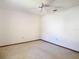 Standard bedroom with carpeted floors, blank walls, and a ceiling fan at 2017 Godfrey Ave, Spring Hill, FL 34609