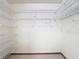 Walk-in closet with metal shelving offering storage and organization at 2017 Godfrey Ave, Spring Hill, FL 34609